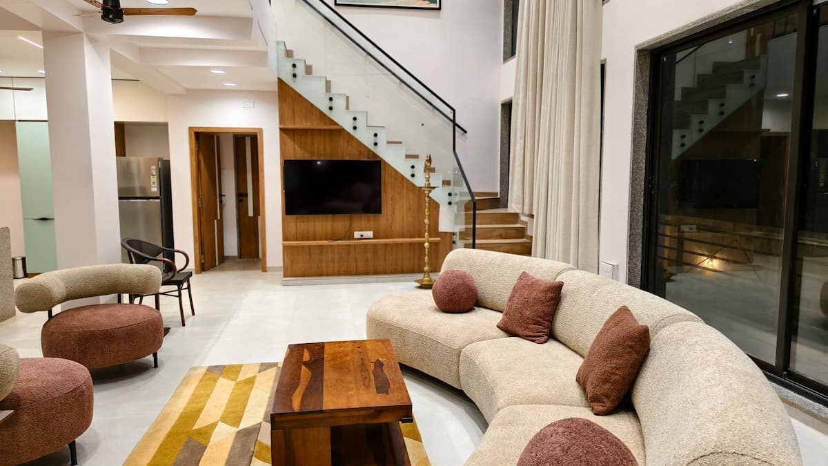 Double-height living room at Aurai Villa Dapoli