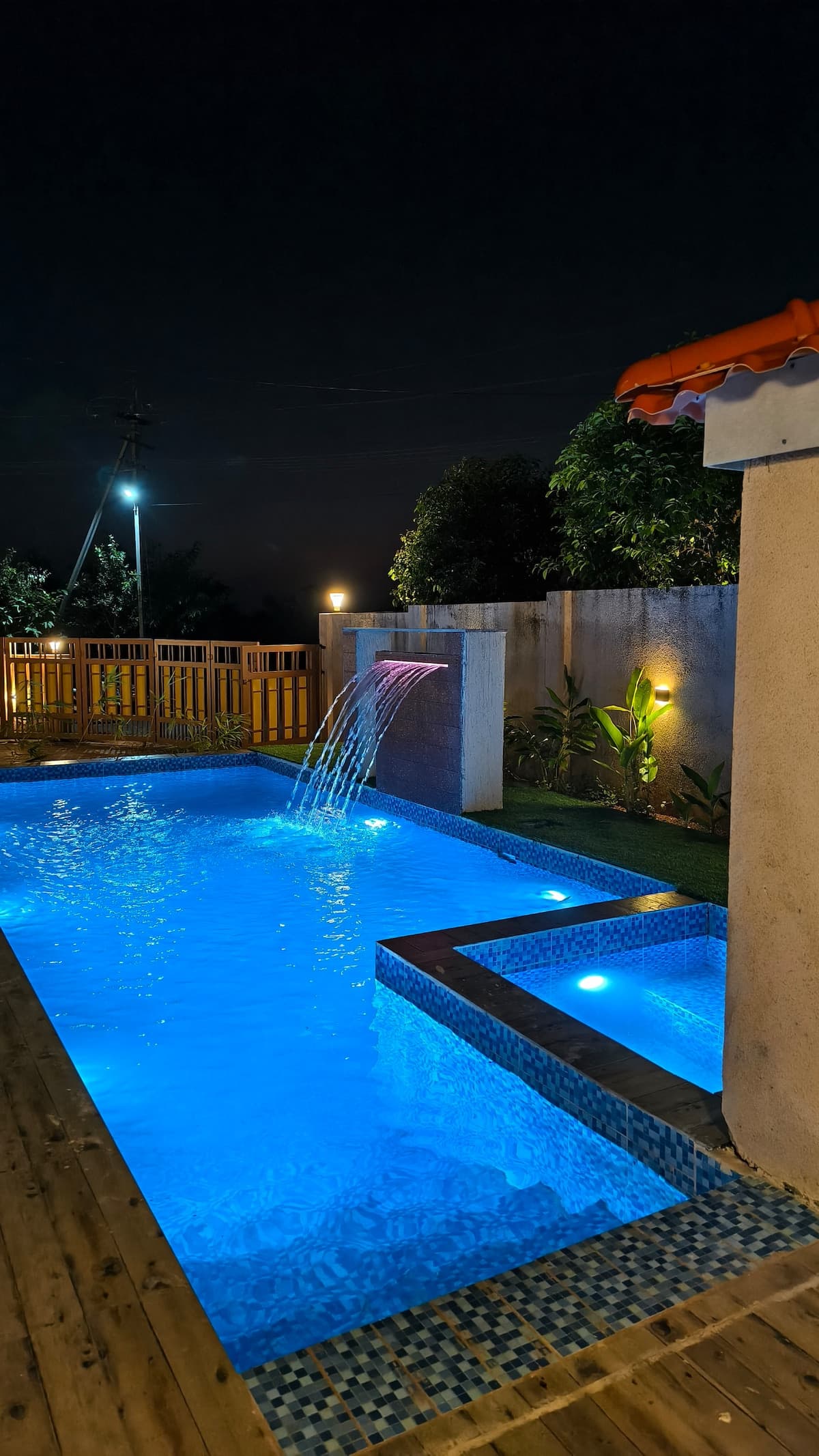 Private swimming pool at Aurai Villa with ocean backdrop