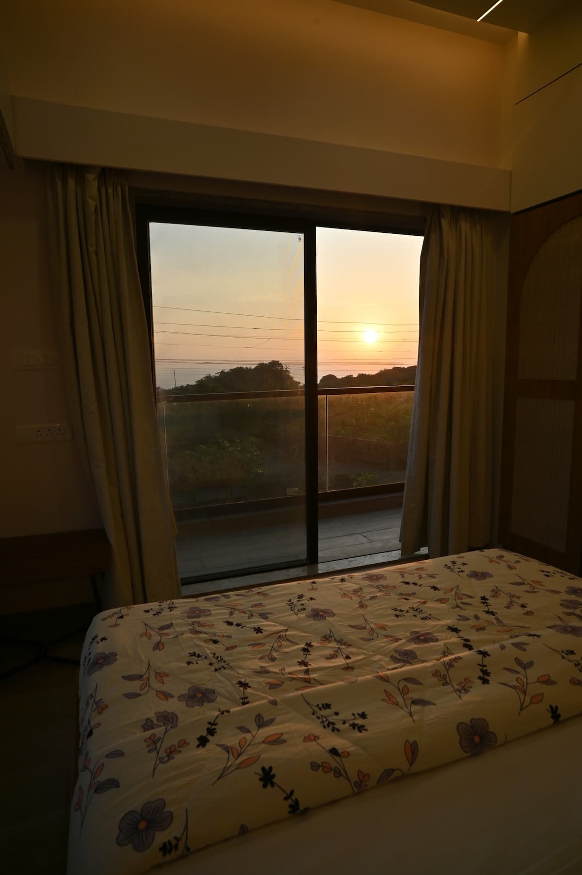 Sunset Room with warm interiors at Aurai Villa Dapoli